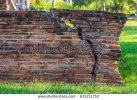stock-photo-red-brick-wall-with-a-big-crack-conceptual-image-bad-quality-bad-construction-631211.jpg