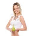 a-young-blond-woman-holding-a-fresh-green-pear-400-32820894.jpg
